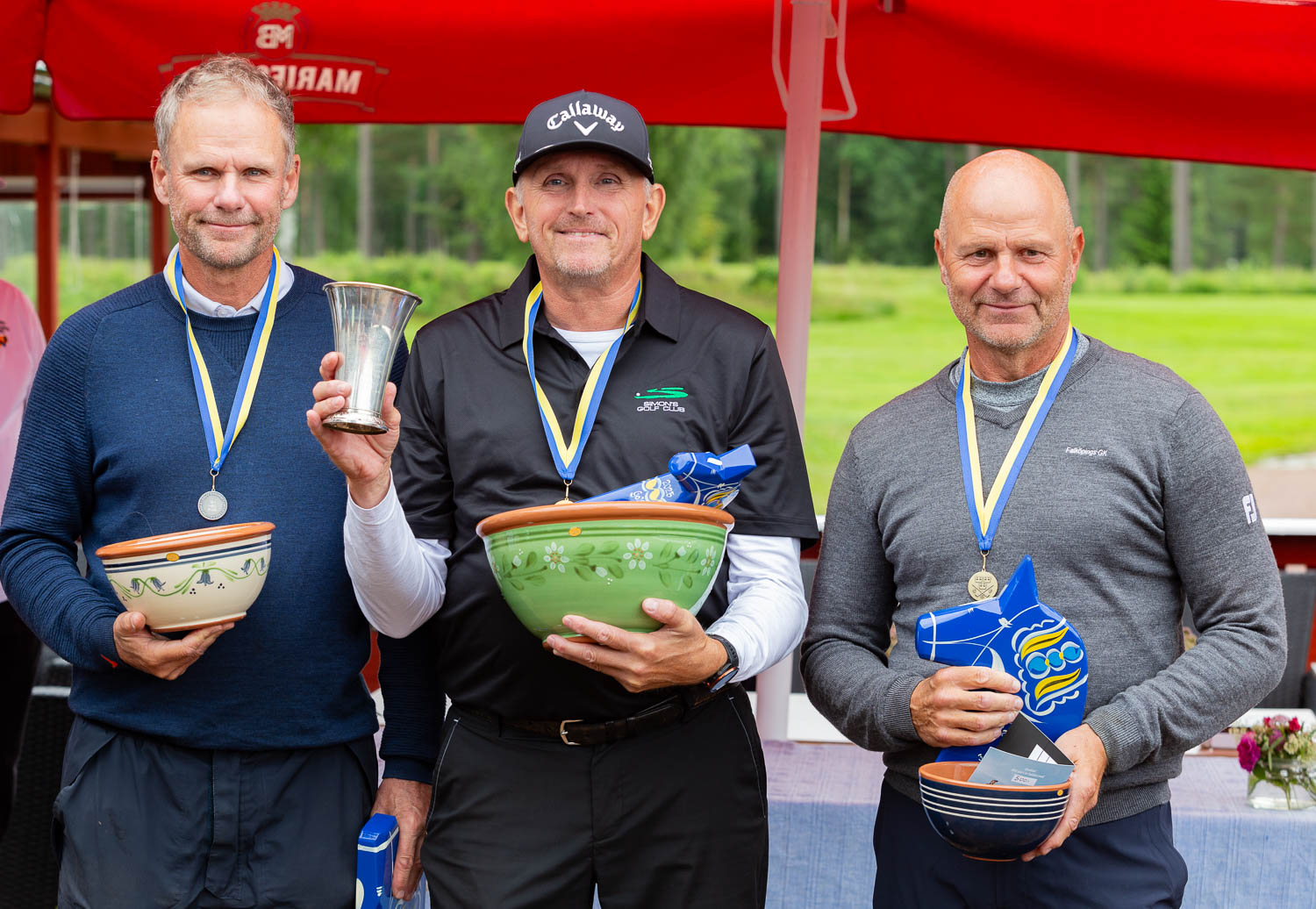 Segraren Michael C. Flindt omgiven av tvåan Magnus Ahlgren och trean Peter Ingvarsson. FOTO: GÖRAN ERLANDSSON